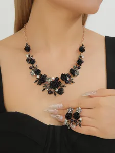 Black enamel camellia pearl necklace and matching earrings set, elegant vintage style jewelry.