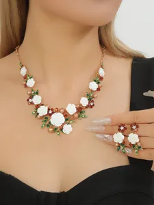 Elegant white camellia flower necklace and earrings jewelry set with sparkling crystals.