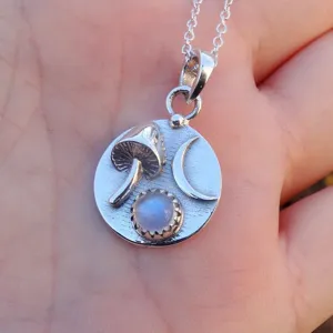 Sterling silver mushroom and crescent moon pendant necklace featuring rainbow moonstone gemstone.