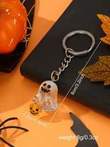 Detail view of Halloween ghost keychain with mini pumpkin, showcasing fine craftsmanship and size.