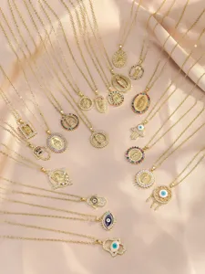 Detailed shot of copper micro-inlaid colorful zircon Virgin Mary and evil eye pendant necklaces.