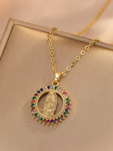 Gold Virgin Mary pendant necklace detail with colorful cubic zirconia stone embellishments.