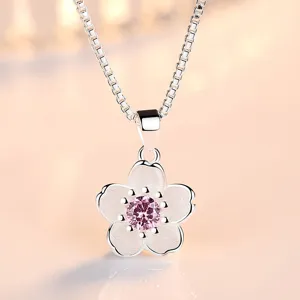 Silver plum blossom pendant necklace with pink crystal, elegant jewelry for women.