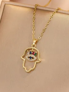 Gold plated Hamsa hand necklace detailed with colorful cubic zirconia and evil eye design.