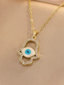 Gold hamsa hand evil eye pendant necklace with micro-pave cubic zirconia details.