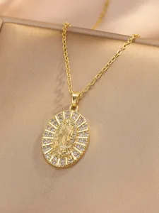 Detailed close-up of gold-plated Virgin Mary pendant necklace sparkling zircon detail.