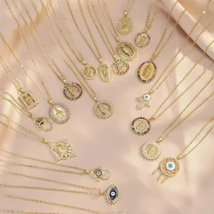 Gold layered necklaces set featuring virgin mary, hamsa hand, and evil eye pendants.
