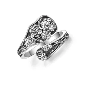 Detailed view of the vintage embossed carnation spoon ring with an antique silver finish.