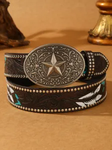 Vintage western style leather belt detail, embossed floral pattern and star buckle.