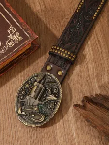 Vintage American Western style genuine leather belt with detailed carved revolver metal buckle.