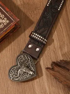 Western vintage carved leather belt with metal heart bull buckle for stylish outfits.