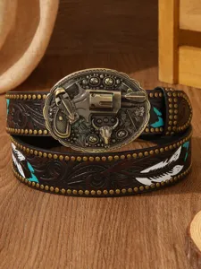 Detailed close-up of western leather belt featuring vintage gun buckle and carved feather details.