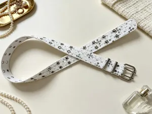 White punk style star studded double buckle belt, stylish metal eyelet accessory for jeans.