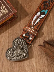 Vintage western style leather belt with carved feather pattern and heart metal steer buckle.