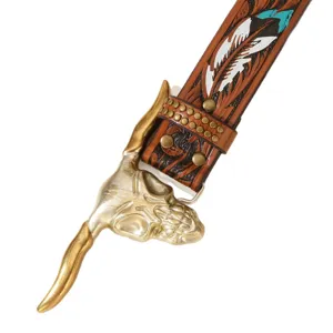 Western vintage leather belt with carved feather pattern, stylish bull skull buckle, and rivets.