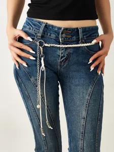 Fashionable metal and white rope waist chain detail shot, stylish belt accessory.