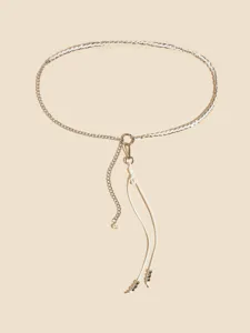 Elegant white leather and silver chain belt with pearl charm, chic waist accessory for women.
