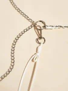 Stylish metal chain and white leather waist belt accessory, perfect for dresses and suits.