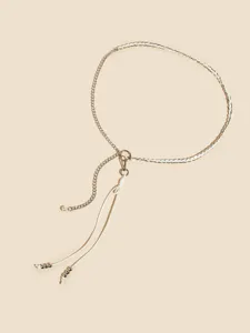 Close-up detail view of elegant metal chain and white leather cord belt for styling.