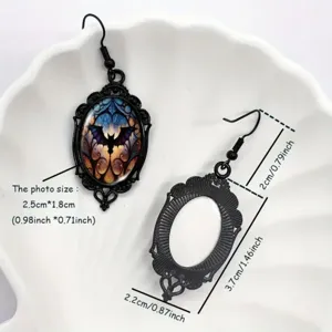 Vintage gothic oval bat earrings with hollow metal frame, unique Halloween statement jewelry.
