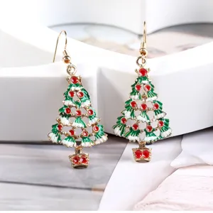 Close-up detail of Christmas tree drop earrings with colorful rhinestones and enamel finish.