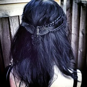 Detailed view of vintage gothic Viking raven hair clip with intricate black metallic bird design.