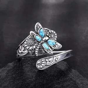 Close-up detail of the vintage silver dragonfly turquoise wrap ring, exquisite carving.