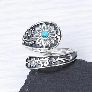 Vintage bohemian silver adjustable ring featuring sunflower and turquoise stone detail for women.