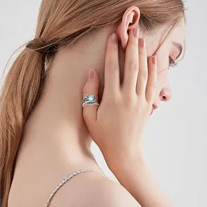 Adjustable moonstone thumb ring with octopus tentacle design, elegant ocean jewelry detail.