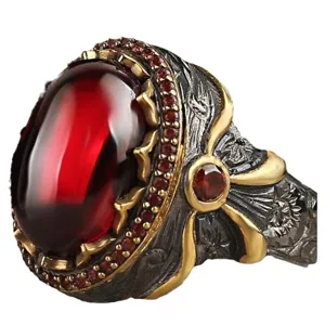 Vintage retro style red stone ring with gunmetal gold carved band for fashion wear.