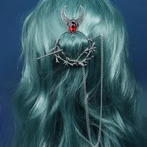 Gothic retro hair stick detail showing intricate branch circle and red rhinestone design.