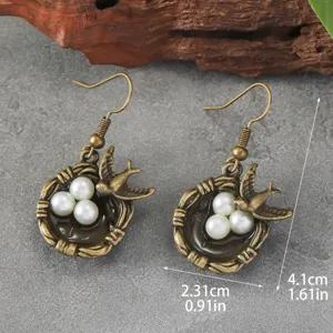 Retro Bronze Schwalbe Vogelnest Perle Ohrringe im ethnischen Stil für Damen.
