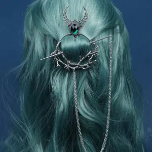 Vintage gothic witch hair stick with green rhinestone crescent moon and drop chains for style.