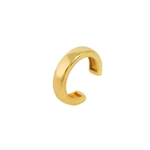 Close up view of minimalist gold geometric ear cuff, sleek polished surface detail for women.