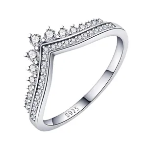 Detailed close-up of a sparkling V-shaped cz paved silver ring, exquisite jewelry detail.