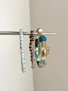 Bohemian multi-layer beaded bracelet detailed view, featuring mixed materials and cute heart charm.