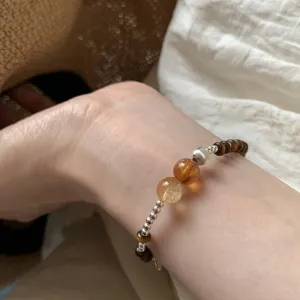 Retro Maillard brown tiger's eye beaded bracelet, elegant silver accent beads, stylish daily jewelry.