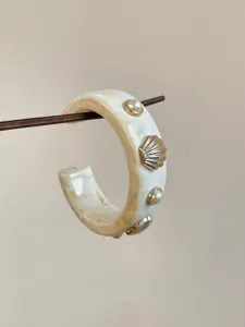 Resin shell pearl cuff bracelet detail, beige marble texture wide bangle aesthetic jewelry
