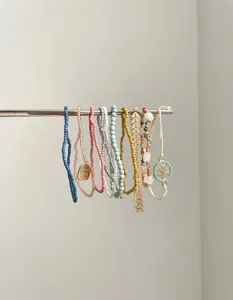 Vintage multi-layer beaded bracelets set, chic stacked design with delicate charms.