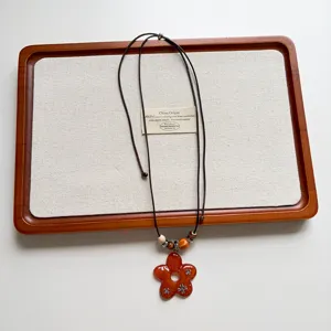 Detailed view of vintage flower beaded long necklace sweater chain accessory for women