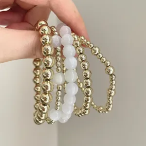 Vintage multi-layer stacked beaded bracelet, elegant gold and white gemstone jewelry for women.