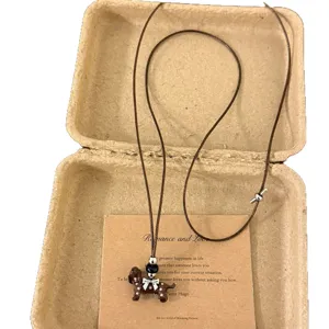 Korean ins style cute spotted puppy necklace with adjustable brown cord for women fashion.