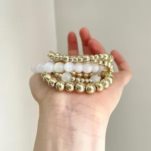 Vintage layered beaded bracelet set, gold and white round beads stacking jewelry for women.