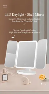 Vista detallada del espejo de maquillaje LED tríptico con cristal HD en mesa.