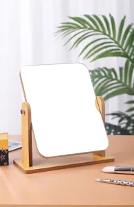Detail showing the 360-degree rotating wooden makeup mirror on a desktop scene.