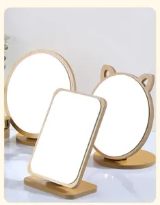 Set of wooden tabletop vanity mirrors in round, rectangular, and cat-ear shapes.