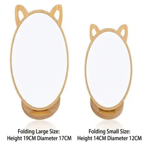 Wooden cat-ear desktop makeup mirrors in two sizes with dimensions: 19x17cm and 14x12cm.
