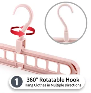 Close-up detail of the 360-degree rotating hook on pink space-saving 9-hole hanger