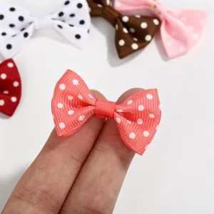Close-up of mini polka dot grosgrain ribbon bows for DIY hair accessories and craft dolls