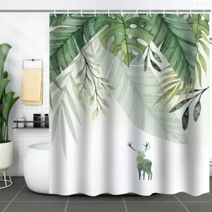 Tropical green leaf shower curtain featuring a watercolor deer silhouette design.